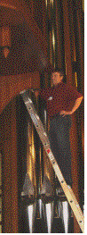 Text Box:  
Figure 1Gary Dodd prepares to inspect the upper works of the Martin Ott organ.

